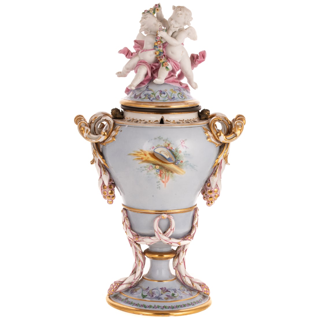 A French Porcelain Potpourri Urn: A French porcelain potpourri lidded urn depicting a painted image of a boy pushing a girl on a swing and floral motifs, with gilt and garland accents, and two putti with flowers and garland on lid, un