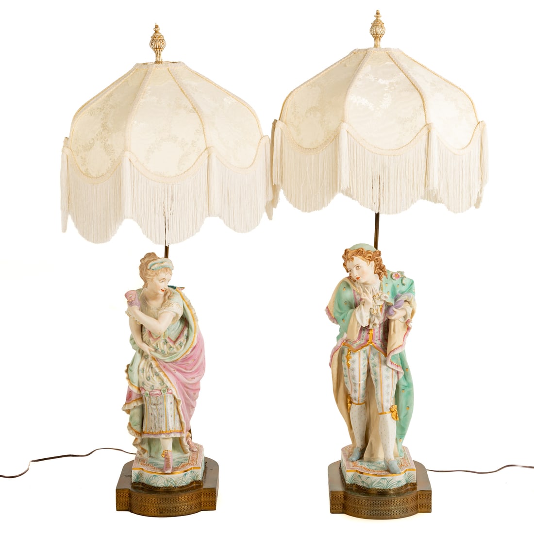 A Pair of Bisque Figural Table Lamps: Mid-20th century, a pair of painted bisque masquerade figural table lamps, one a woman and one man, figures mounted as lamps, gilt accents, female figure not fully affixed, marked "Sylvan China" on th