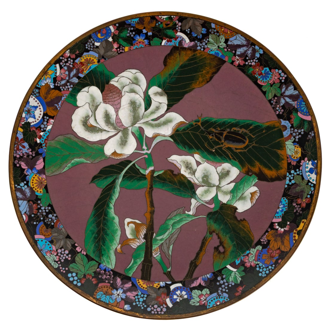 A Japanese Cloisonne Charger: (Japanese, late 19th/early 20th century) A Japanese cloisonne enamel charger with brass rim and Magnolia and beetle central image, floral and leaf motifs around rim, 2 1/4 in. H, 14 3/4 in. Diam.