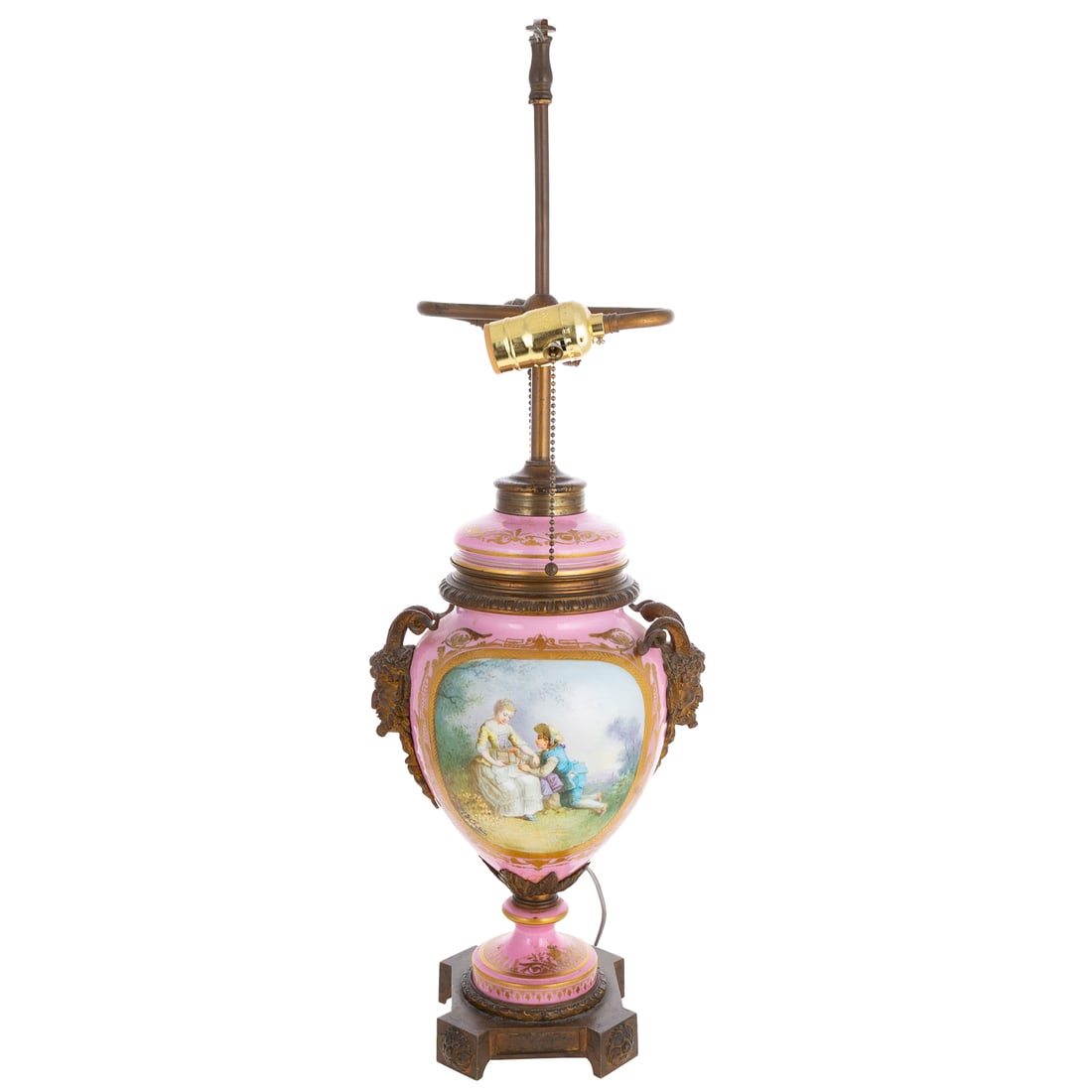 An Early Sevres Porcelain Vase Mounted as Lamp: Circa 1779, a metal mounted Sevres porcelain table lamp with painted flowers on one side and a courting scene on the other, and gilt accents, metal mounted satyr handles , mark visible on bottom, 26 i