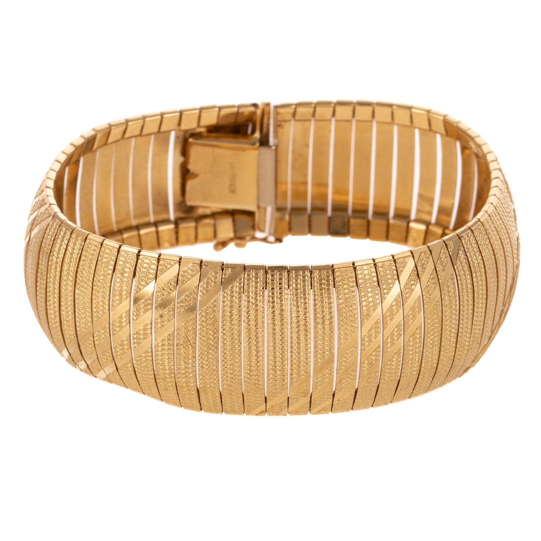 A Wide Diagonal Design Omega Bracelet in 14K: 14K yellow gold bracelet made in Italy designed with diamond cut diagonal design with striped accents, box clasp with safety latch, 3/4 in. W, 6 7/8 in. L, 32.3 grams Provenance: From the Estate of
