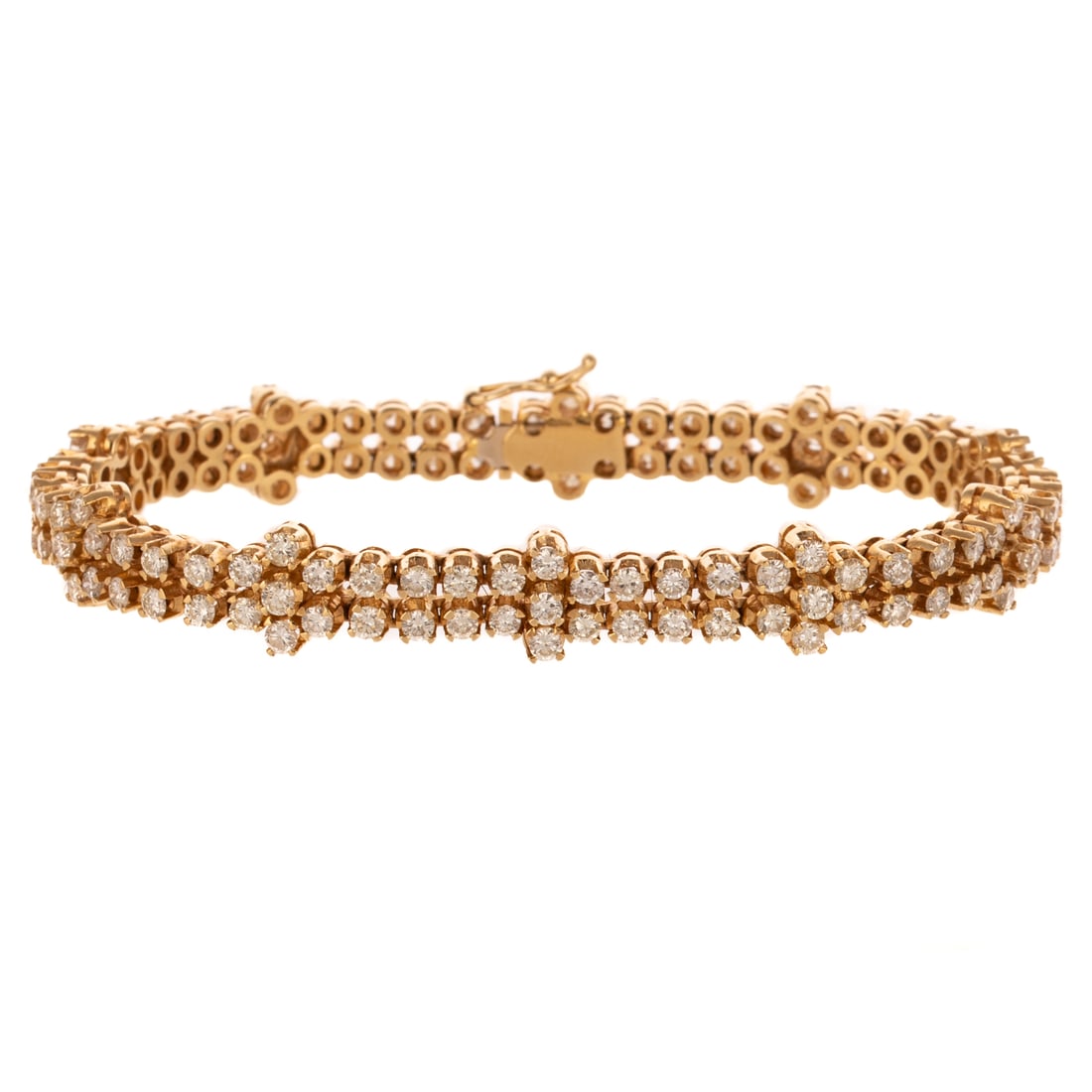 A 6.50 ctw Diamond Link Bracelet in 14K: 14K yellow gold fancy double link bracelet made in Italy featuring well matched round diamonds weighing approx. 6.50 ctw with an average color grade of I - J and an average clarity grade of SI, box cl