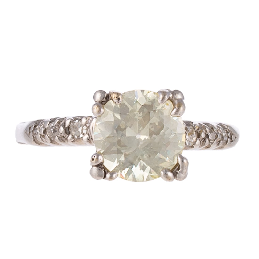 A 1.85 ct Classic Diamond Ring in 14K: 14K white gold ring featuring an Old European cut diamond weighing approx. 1.85 carats with an average color grade of M - N and an average clarity grade of VS set in center with diamonds bead set into