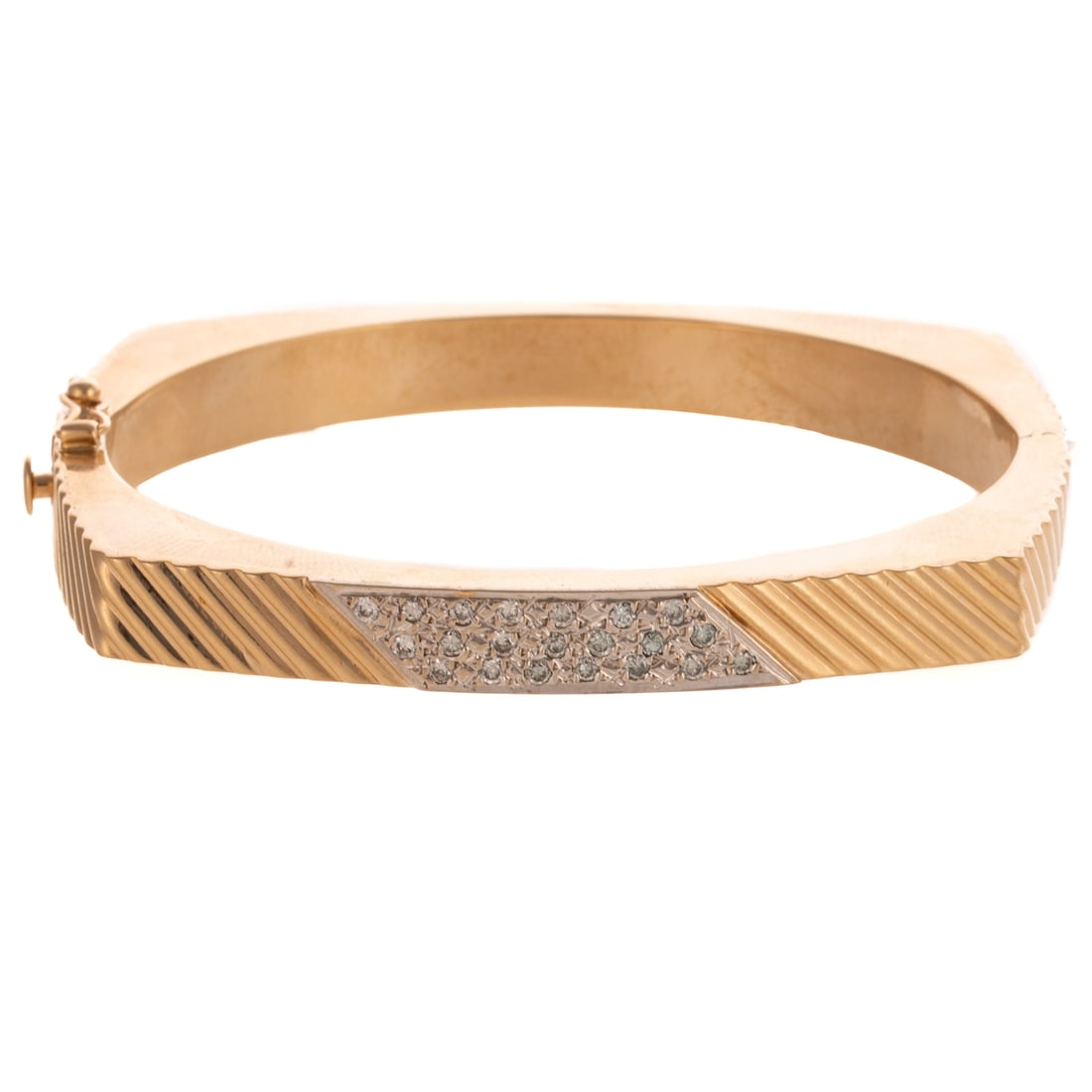 A Modern Pave Diamond Diagonal Bangle in 14K: 14K yellow gold oval hinged bangle bracelet featuring pave set diamonds weighing approx. 0.40 ctw centrally set among diagonal ridges throughout entire squared off bracelet, box clasp with safety latc
