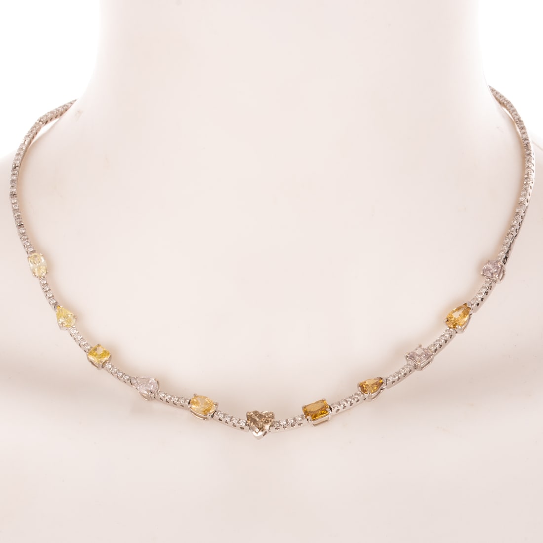 A GIA Fancy Colored Diamond Necklace in 18K: 18K white gold diamond necklace featuring approx. 11.00 ctw of natural colored, fancy colored and white diamonds, including eleven main colored diamonds (10 accompanied by GIA certificates) set in pro