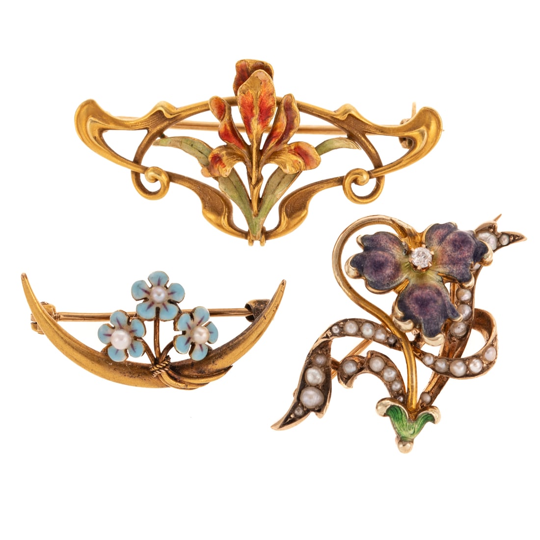 A Trio of Art Nouveau Floral Pins in 14K: c.1890s, 14K yellow gold pins including 1) crescent shape with blue enamel flowers and seed pearls by Krementz, signed, 1 in. L, 2) enameled blossom with central round diamond accent, enameled