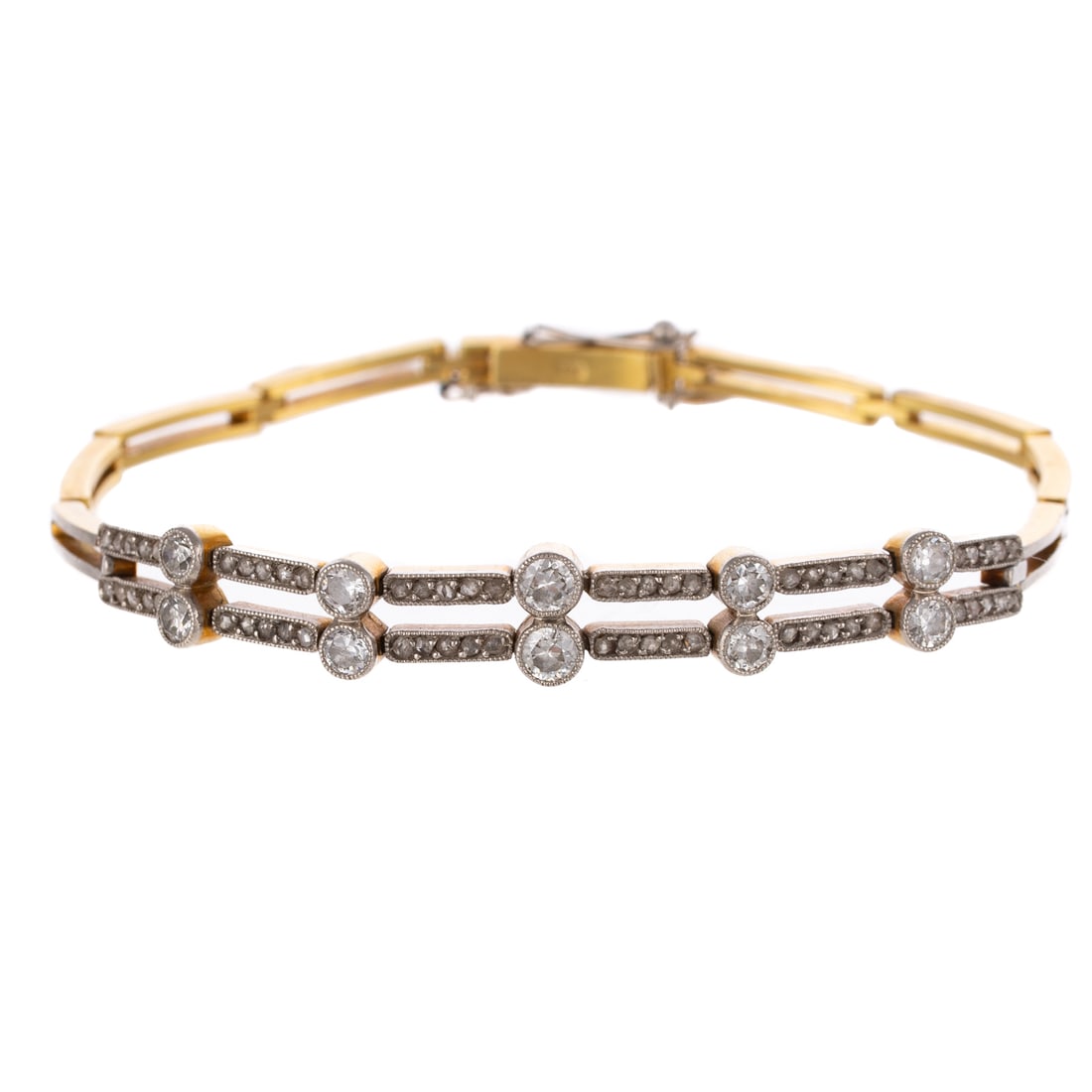 An Early Art Deco Diamond Bracelet in 18K: c.1910s 18K yellow gold, platinum topped bracelet featuring old European cut diamonds weighing approx. 1.35 ctw bezel and bead set in slightly graduated design with milgrain accents, high polish open 