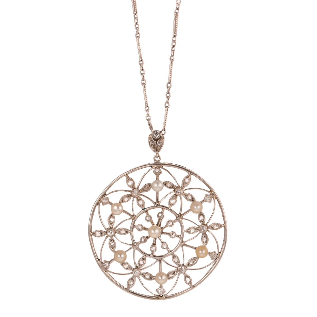 An Edwardian Pearl & Diamond Pendant & Chain in Platinum: c.1900s, Platinum geometric floral open circle pendant featuring seed pearls and Old Mine and rose cut diamonds, 1 1/2 in. W, hanging on platinum bar link chain with spring ring clasp, 17 in. L, 12.4 