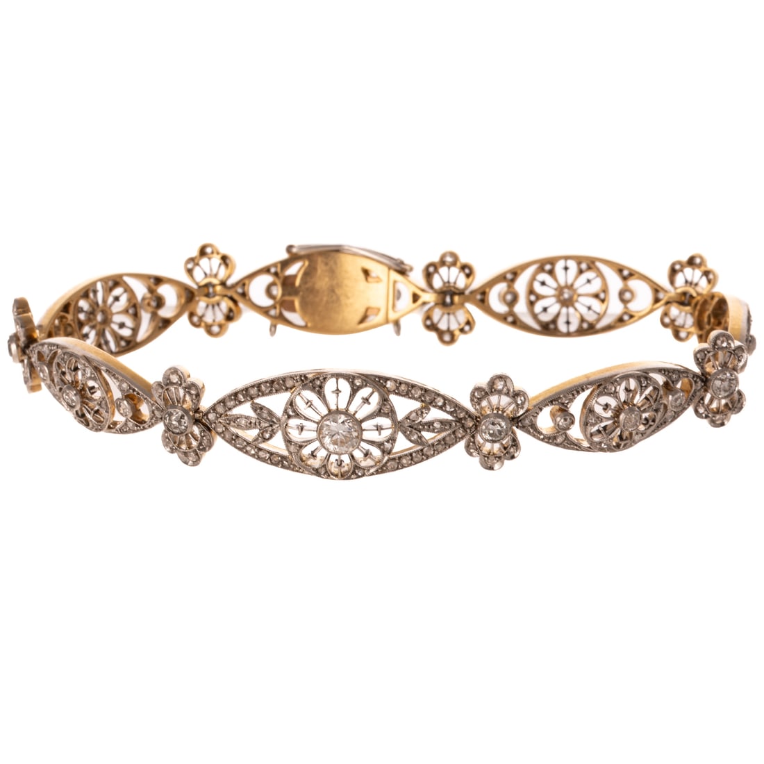 An Edwardian Diamond Bracelet in 18K & Platinum: c.1900s 18K yellow gold platinum topped bracelet featuring navette shape open flower links with Old European cut diamonds weighing approx. 2.00 ctw, hidden box clasp with curved safety latch, 7 1/2 in