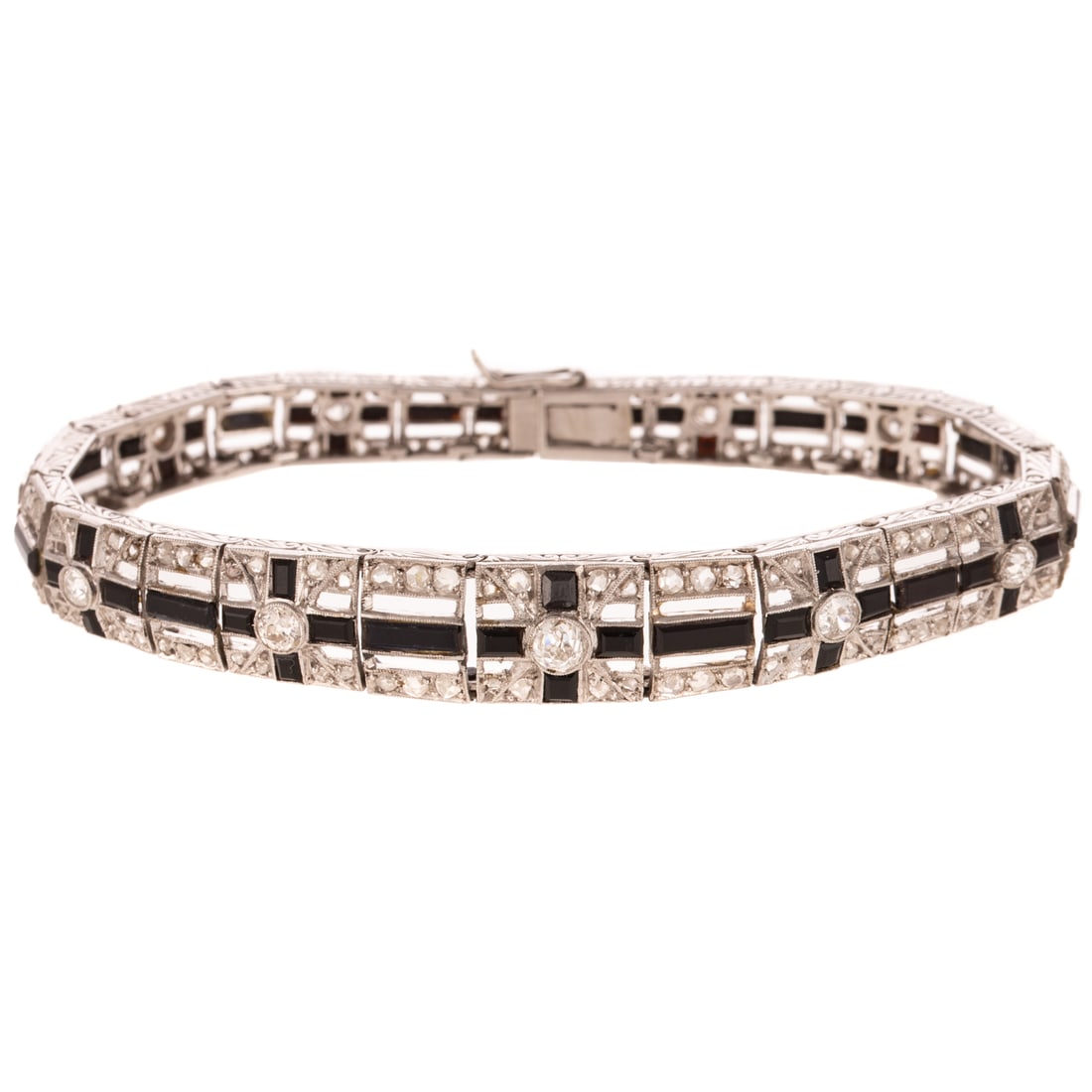 An Art Deco Diamond & Onyx Bracelet in Platinum: c.1920s, platinum slightly tapered bracelet in a geometric design featuring Old European cut diamonds weighing approx. 2.60 ctw, milgrain accent, with channel set faceted black onyx set down the cente