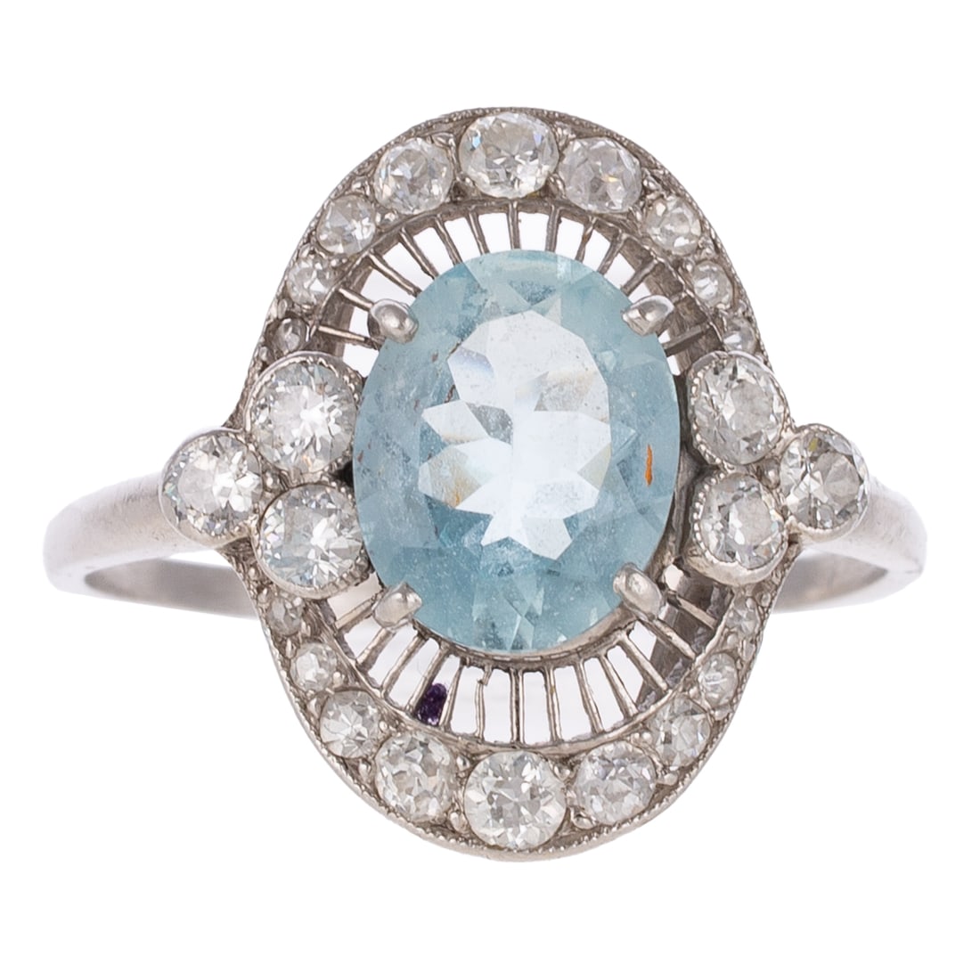 An Edwardian Aquamarine & Diamond Ring in Platinum: c.1900s, platinum ring featuring an oval aquamarine weighing approx. 2.00 carats with trio of Old European cut diamonds on either side of aquamarine and on the top and bottom of elongated filigree fra