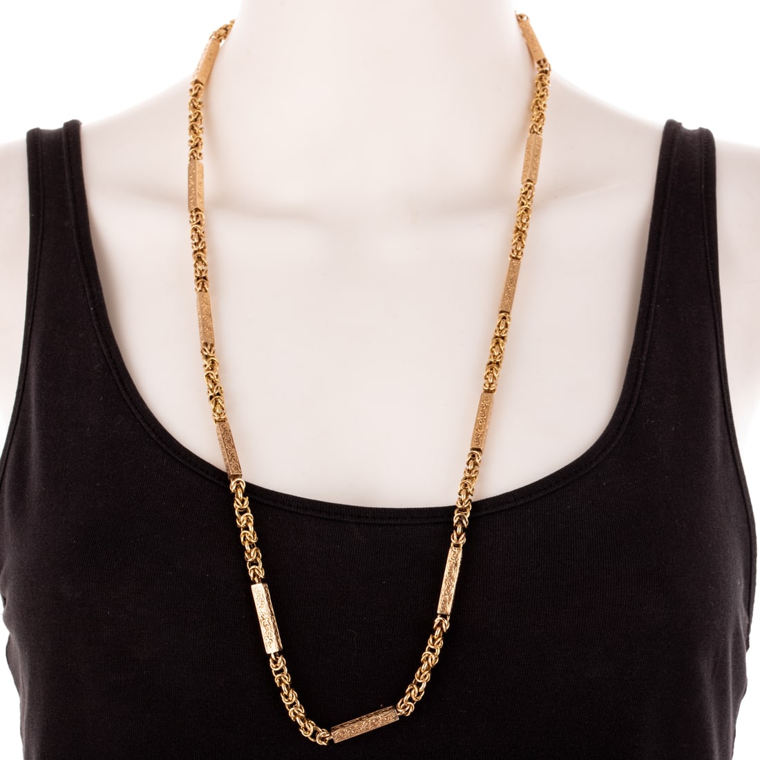A Victorian Engraved Byzantine Link Necklace in 14K: c.1880s, 14K yellow gold necklace featuring 12 long rectangular scroll links alternating with Byzantine links, spring ring clasp, 31 in. L, 33.4 grams Provenance: From the estate of a private collecto