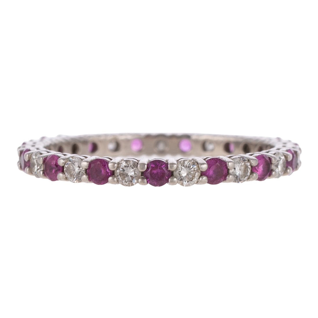 A Tiffany & Co Pink Sapphire & Diamond Eternity Band in Platinum: Platinum eternity band by Tiffany & CO featuring shared prong set pink sapphires weighing approx. 0.60 ctw alternating with diamonds weighing approx. 0.30 ctw, sz 7.5, signed, 2.4 grams Provenance: Fr