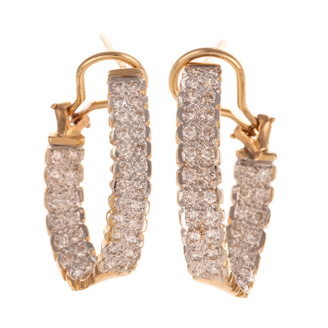 A Pair of Diamond Inside Out Hoops in 14K: 14K yellow gold inside out curved mirror hoops featuring round diamonds weighing approx. 2.60 ctw with an average color grade of G - H and an average clarity grade of SI, posts with Omega backs, 1 1/4