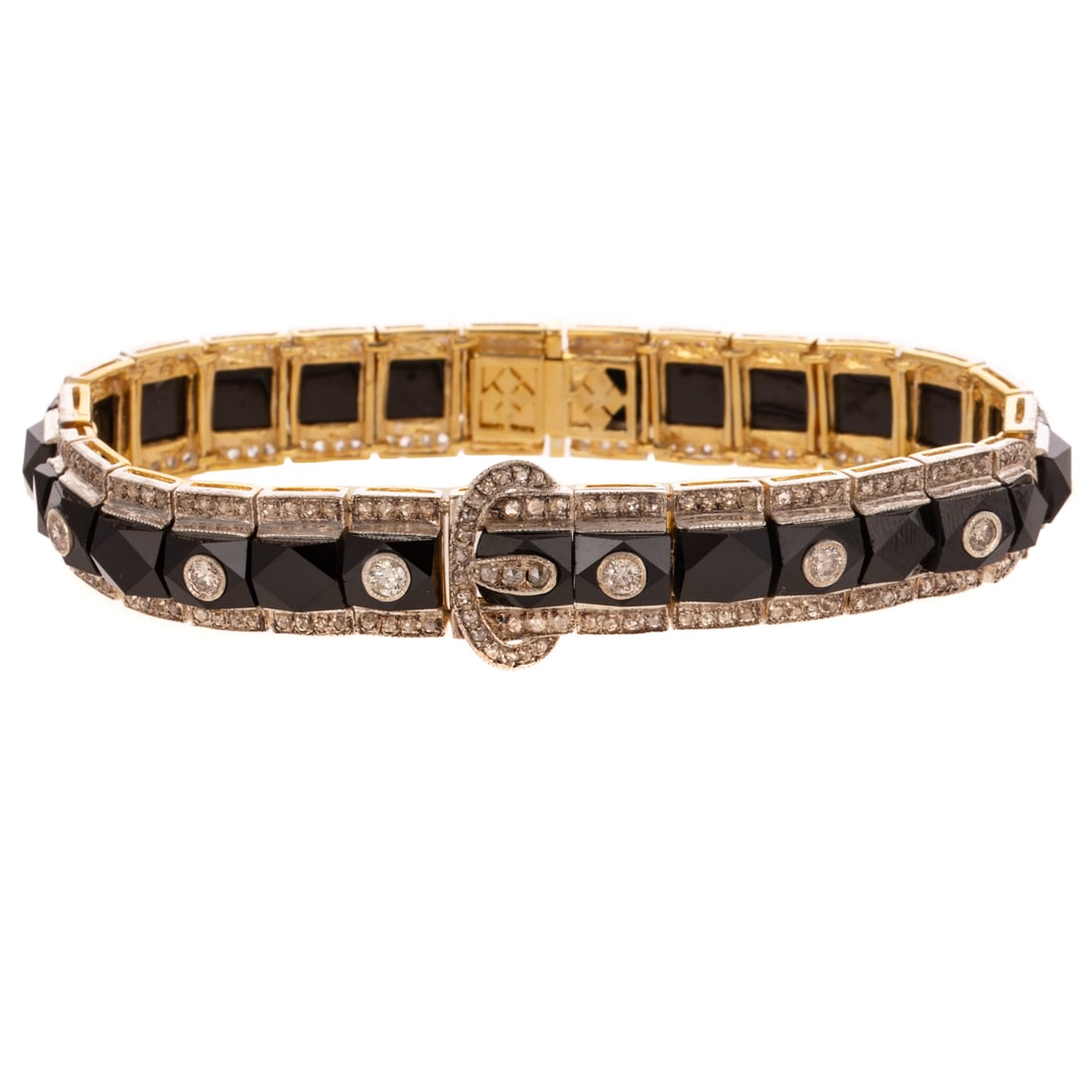 An Art Deco Style Diamond & Onyx Buckle Bracelet: Vermeil and sterling silver buckle bracelet featuring a central row of French cut onyx channel set bordered by rose cut diamonds bead set and across the buckle, six Old European cut diamonds bezel set
