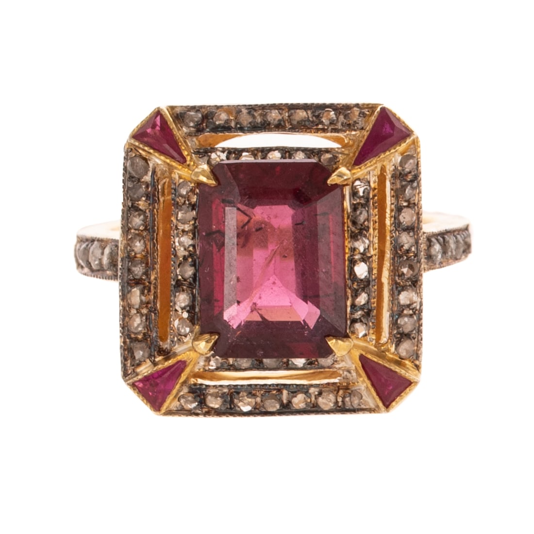 A Rubellite Tourmaline & Diamond Ring: Vermeil and sterling silver ring featuring an emerald cut rubellite tourmaline weighing approx. 2.35 carats prong set and with a double halo of rose cut diamonds bead set weighing approx. 0.50 ctw,