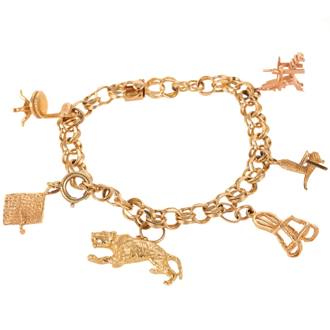 A Chair-Themed Charm Bracelet in 14K: 14K yellow gold double link bracelet with high polish and florentine finish links featuring six 14K charms including three chairs, a lion, and a graduation cap with a spring ring clasp, box clasp