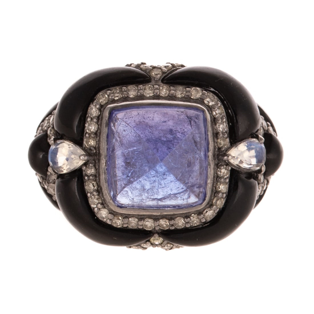 A Sugarloaf Tanzanite, Onyx & Moonstone Ring in 14K: 14K yellow gold and sterling silver ring featuring a sugarloaf tanzanite weighing approx. 5.40 carats set in the center with custom cut black onyx sections separated by bead set diamonds and pearl