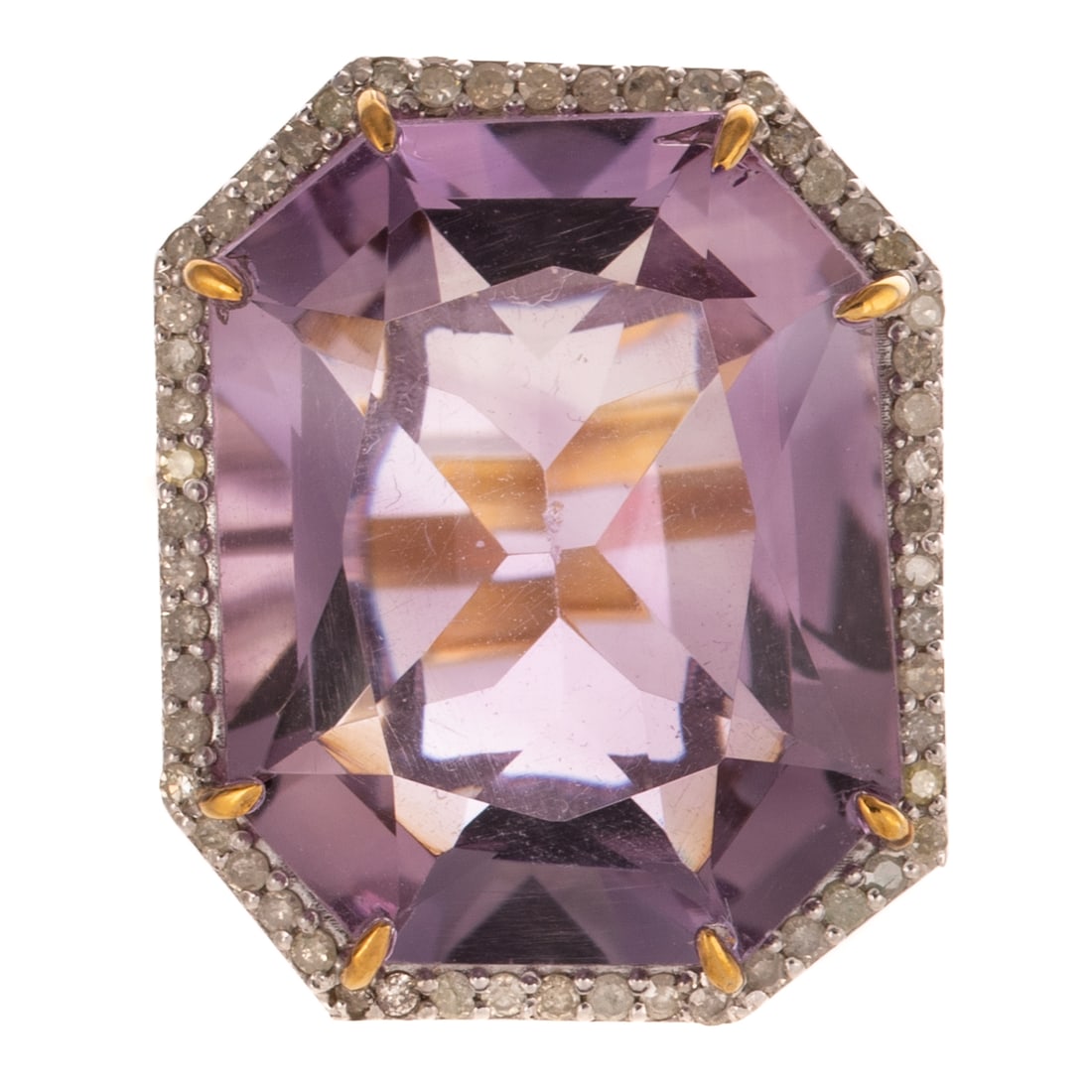 An Amethyst & Diamond Cocktail Ring in 14K: 14K yellow gold and sterling silver ring featuring an emerald cut light purple amethyst weighing approx. 24.65 carats set in prongs with diamond halo weighing approx. 0.55 ctw, yellow gold shank, sz