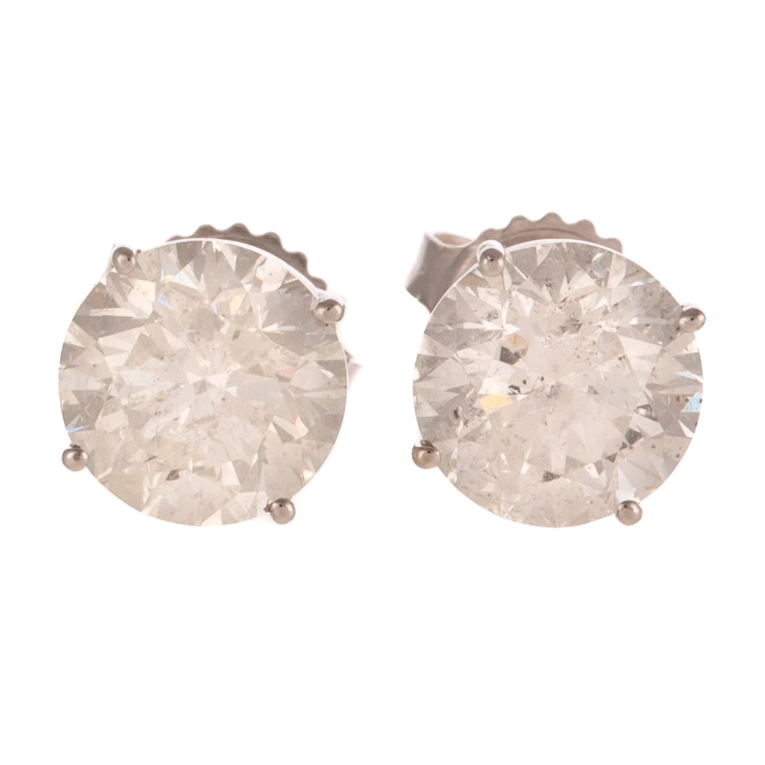 A Pair of 4.00 ctw Diamond Studs in 14K: 14K white gold solitaire studs featuring round diamonds weighing approx. 4.00 ctw with an average color grade of H - I and an average clarity grade of I prong set in a basket setting, posts with
