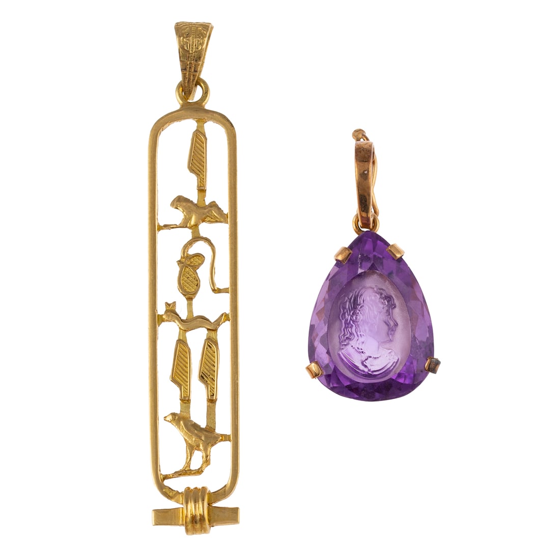 An Egyptian Hieroglyphic & Amethyst Cameo Pendants in Gold: 1) 18K yellow gold hieroglyphic pendant, engraved bail, 2 1/4 in. L, and 2) 14K yellow gold pendant featuring a pear shaped amethyst with a cameo of a woman carving measuring 20 x 15.5 mm prong set,
