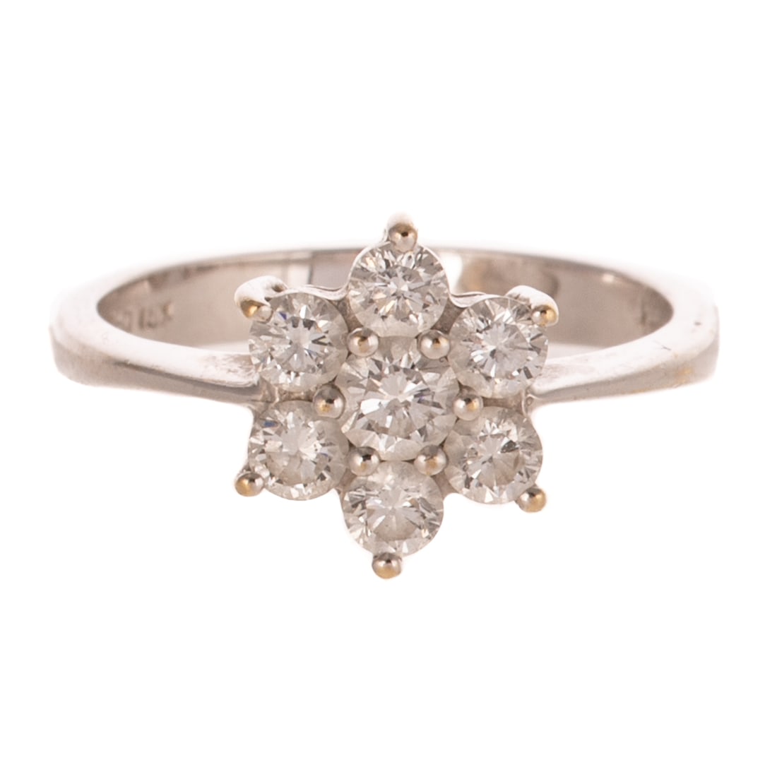 A Diamond Flower Cocktail Ring in 18K: 18K white gold ring featuring seven round diamonds weighing approx. 0.65 ctw with an average color grade of G - H and an average clarity grade of VS prong set in to flower design, sz 5.5, 2.7 grams