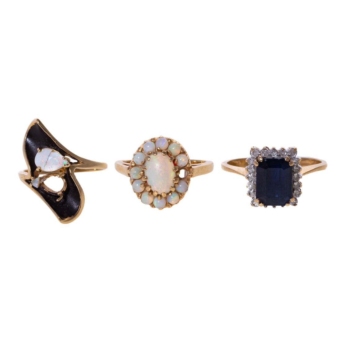 A Trio of Gemstone Rings in 14K: 1) 14K yellow gold ring featuring an emerald cut sapphire 8.2 x 5.9 mm, claw prong set with a halo of round diamonds, sz 5, 2) 14K yellow gold ring with an oval cabochon opal 8.5 x 6.5 mm, prong set a