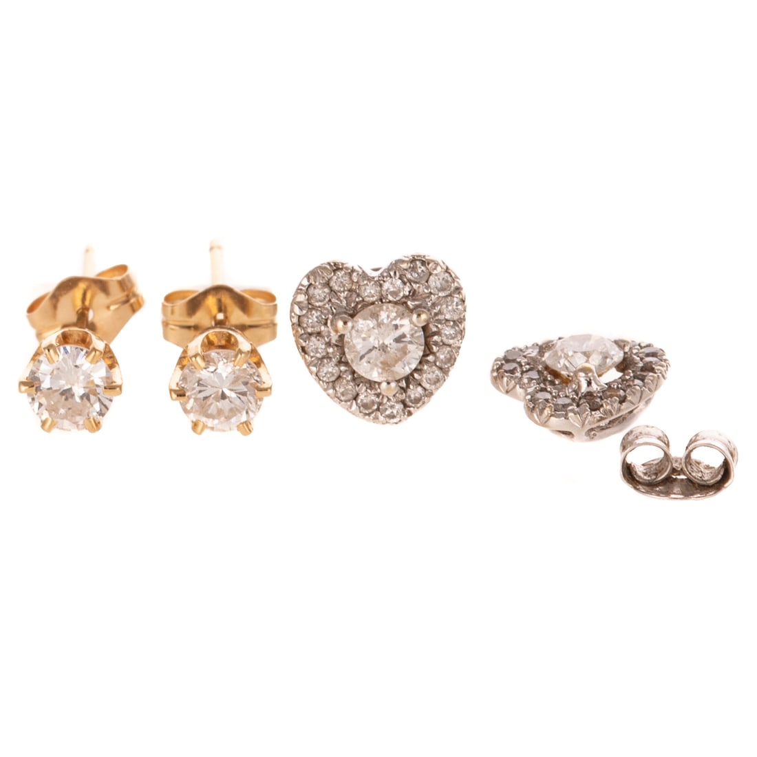 Two Pairs of Diamond Ear Studs in 14K: 1) 14K white gold studs in the shape of hearts featuring a central round diamond prong set and with a halo of diamonds bead set, all weighing approx. 0.50 ctw, post with friction backs, and 2) 14K yel