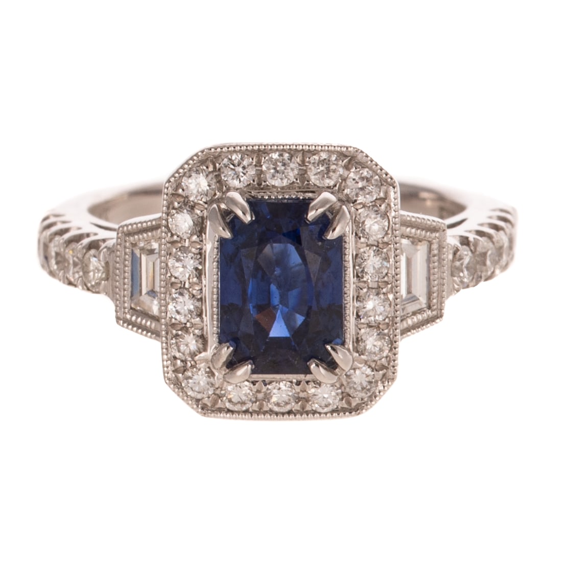 A GIA 1.89 ct Ceylon Sapphire & Diamond Ring in 18K: 18K white gold ring featuring an emerald cut royal blue Ceylon sapphire weighing 1.89 carats accompanied by GIA Sapphire Origin Report #2241012729, set in center with trapezoid and round diamonds