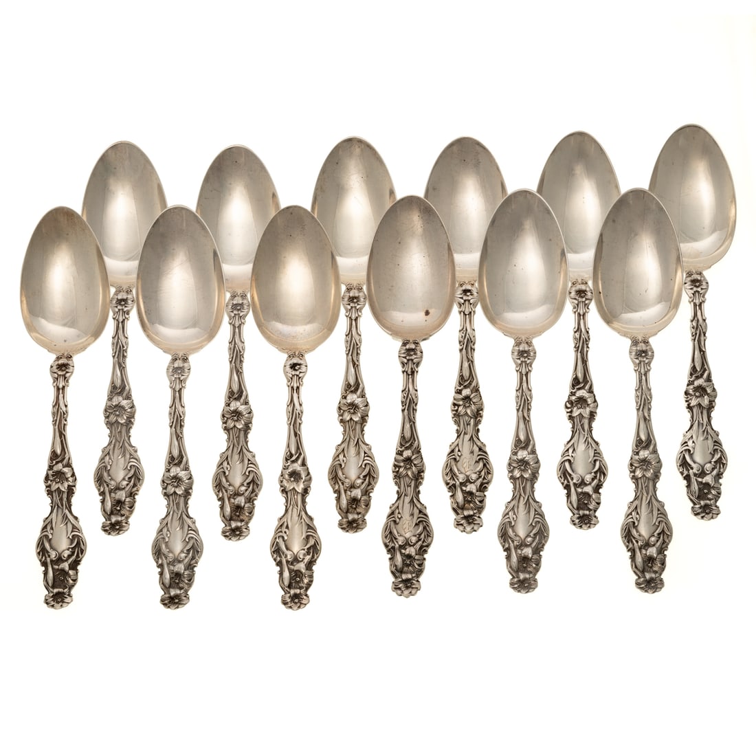 12 Whiting Sterling "Lily" Five O'clock Teaspoons: Two with "D" monogram, 5 3/8 in. L, 9 ozt. Provenance: From the estate of a private collector, Great Falls, VA