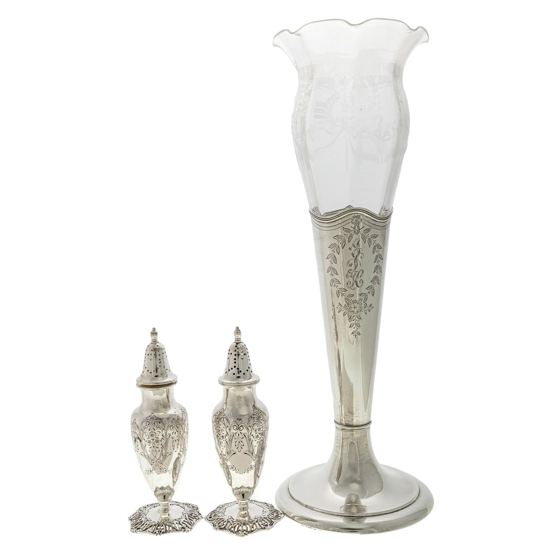 Three Pieces of Rococo-Style Sterling Tableware: Including: Dominick and Haff vase, with chased floral and foliate wreaths, one with "JDH" monogram, with an etched glass insert, vase is 9 7/8 in. H, 14 7/8 in. H overall. 9.4 ozt.; and a pair of