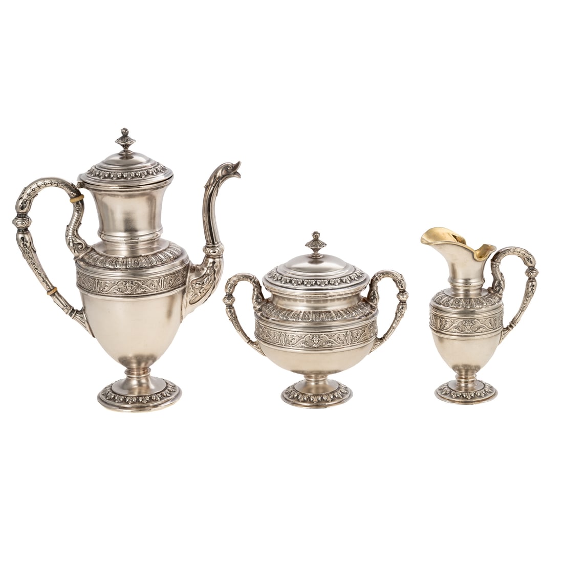 Continental Silver Individual Coffee Set: IHPSS maker's mark, 800 silver standard. Three pieces including a coffee pot, creamer, and sugar, in the Neoclassical style, urn-form, the waist with an applied scrolling foliate and masque border, re
