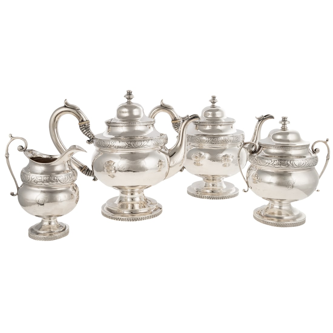 Baltimore Coin Silver Tea & Coffee Service: Assembled service by Samuel Kirk and Philip Benjamin Sadtler, mid-19th century. Comprising coffee pot, teapot, creamer, and sugar. Bulbous, urn-form, the neck with grape cluster, acorn and oak leaf bo