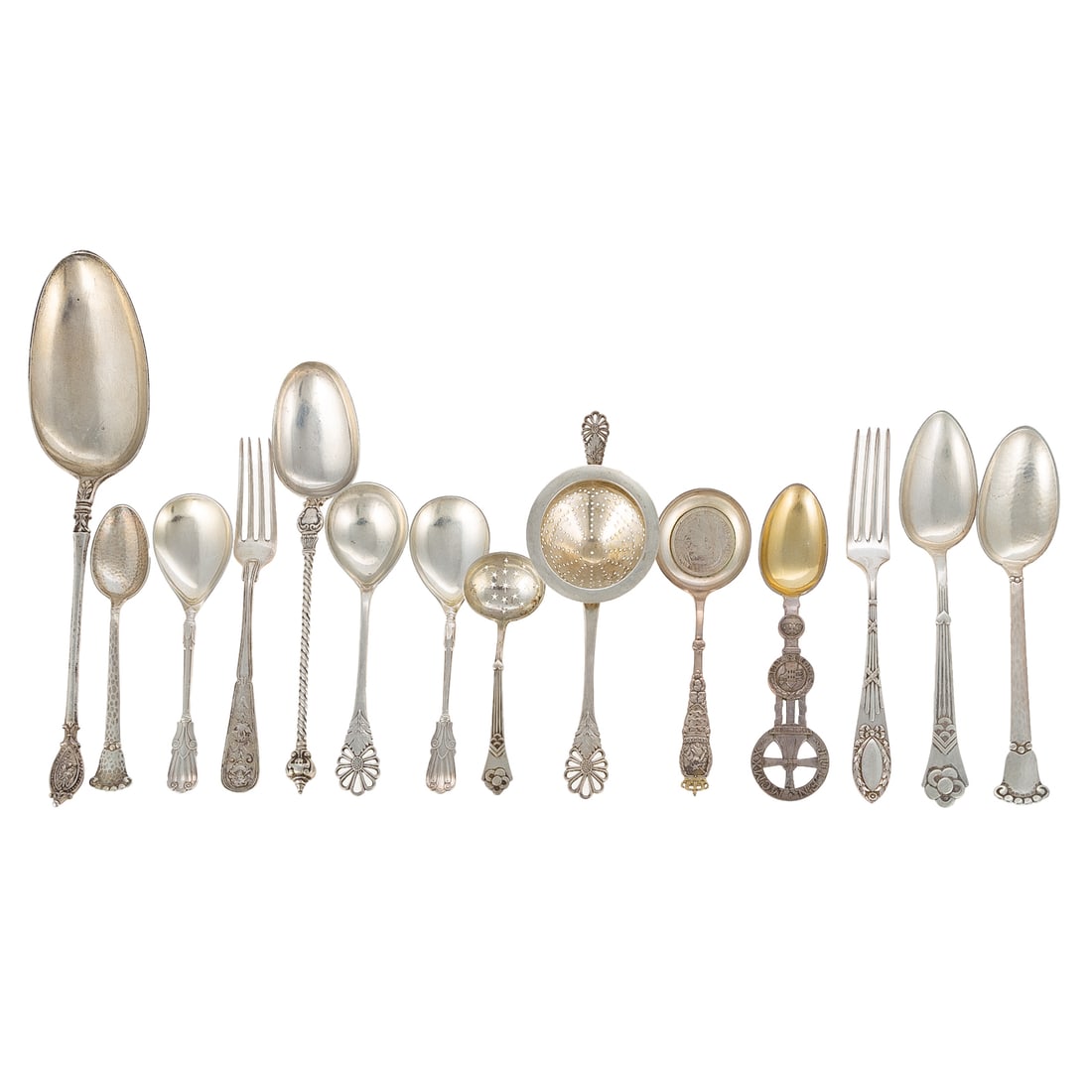 Collection of Danish Silver Flatware: Late 19th-20th century, 826 silver standard. Comprising a selection of 11 spoons, two forks, and a tea strainer, with decorative terminals, including a souvenir spoon with a 2 Kroner coin, post WWI