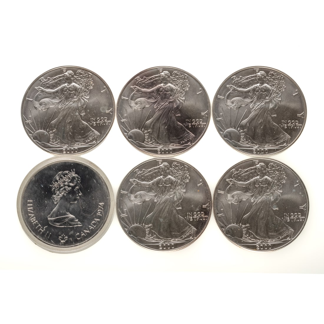 Five Silver Eagles & 1974 $5 Canadian Olympic: American Silver Eagles - 5 year 2000 BU Silver Eagles and 1974 Montreal Olympics $5 (.72 oz)