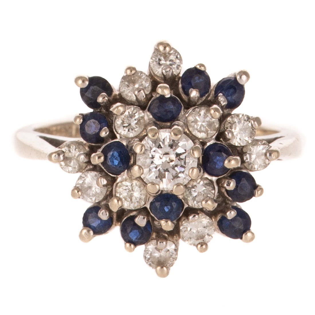 A Sapphire & Diamond Pinwheel Ring in 14K: 14K white gold ring featuring a pinwheel design featuring round diamonds weighing approx. 0.50 ctw and round sapphires, all stones prong set, sz 5.5, 4.4 grams.