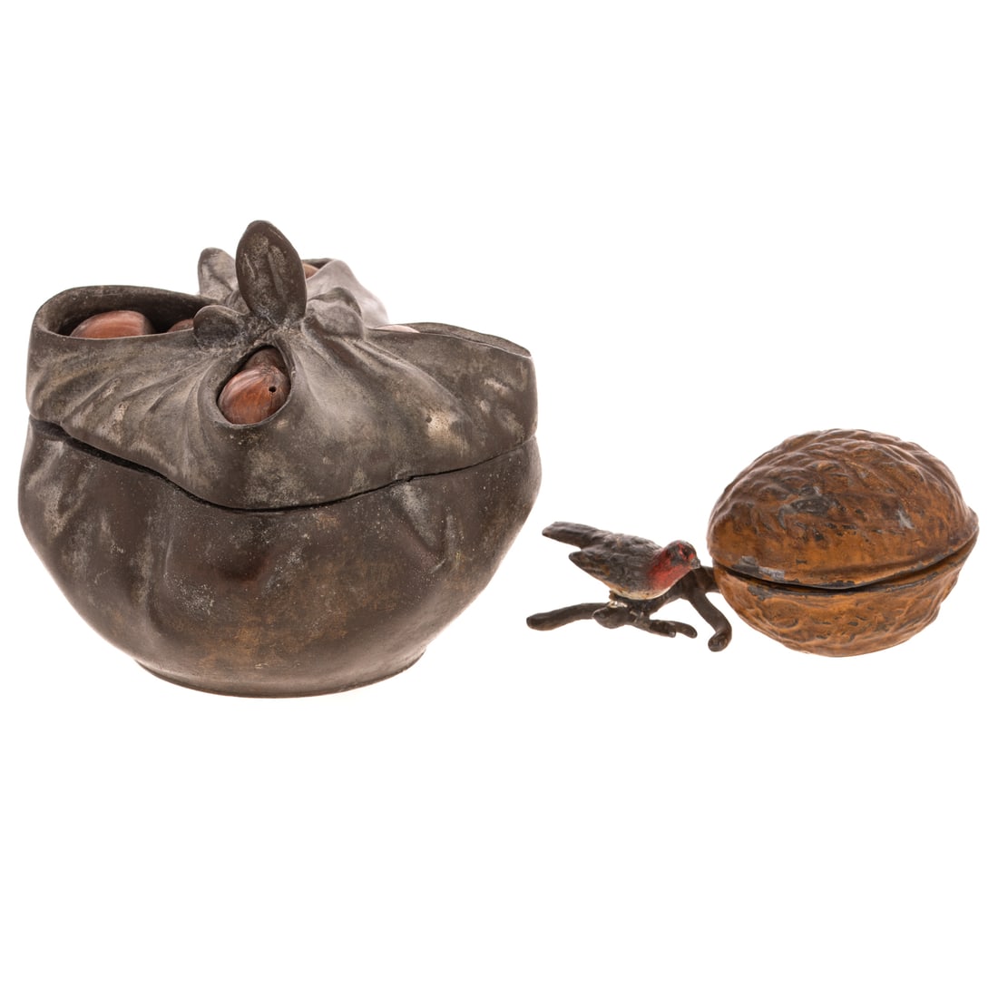 Two Nut Related Whimsical Inkwells: A bronze bag-form inkwell with real acorns inside lid, marked "K" on underside of lid, 3 1/4 in. H, approx. 3 1/4 in. Sq.; and a painted cast iron inkwell in the form of a nut with a branch and bird
