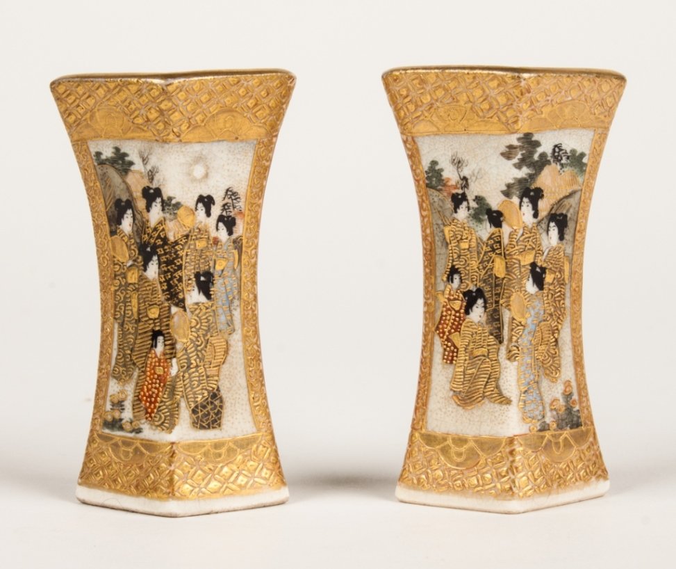 Pair of Japanese Satsuma cabinet vases: late 19th century; rhomboid form earthenware vases, each with vignettes of immortals and geishas, each signed, 3 1/.2 in. H.