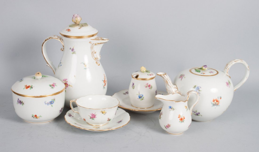 Meissen porcelain 17-piece partial tea set: early 20th century; floral decorated tea and chocolate service, comprising: globular teapot, chocolate pot, sugar bowl, creamer, condiment dish, six cups and six saucers