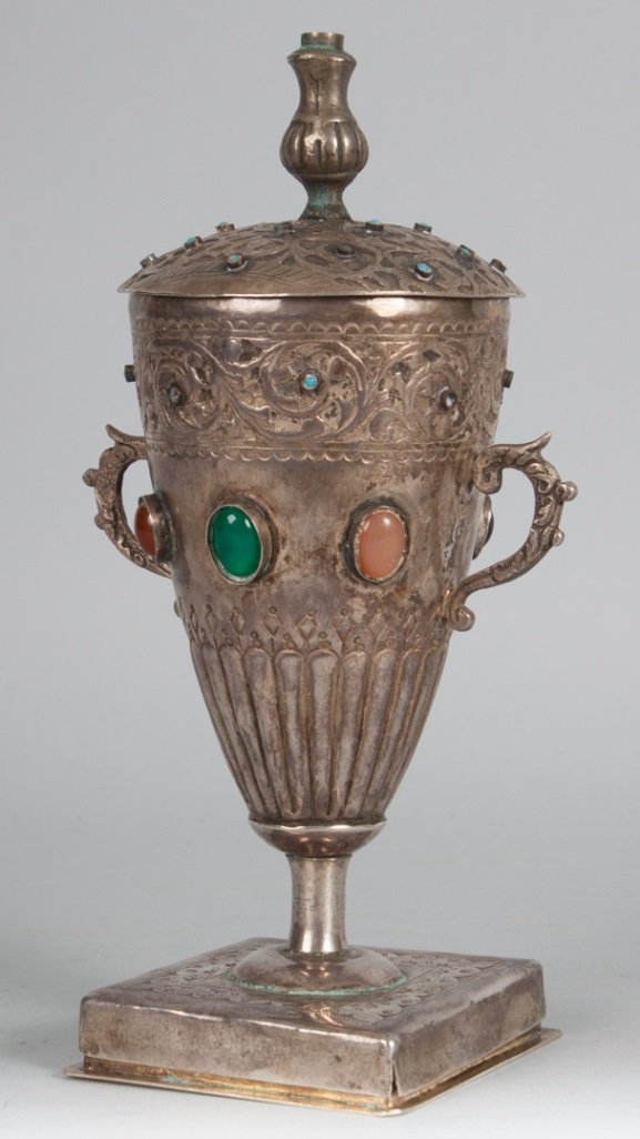Middle Eastern Jewish silver kiddush cup & lamp: combination, for shabat and Chanukkah, late 19th or early 20th century; comprising a covered stem cup with chased designs and multi-colored glass cabochons, removable base bearing Hebrew inscription f
