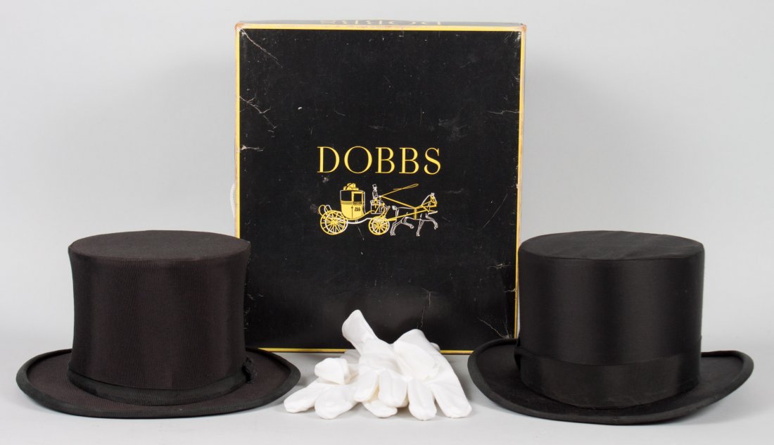 Two black top hats: one with original box, and pair of men's white evening gloves