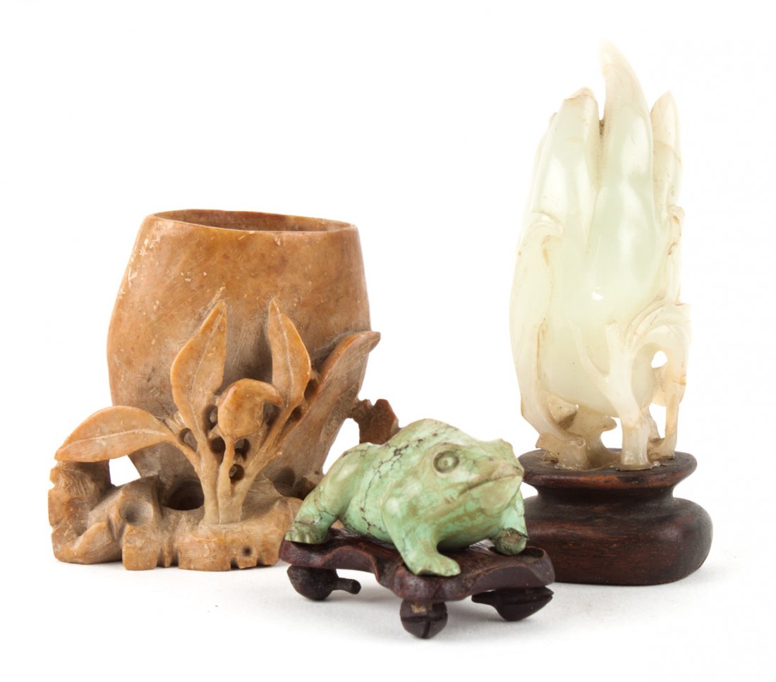 Chinese jade hand of Buddha, and other items: comprising: pale green jade carving of "Hand of Buddha" citron, 19th century or earlier, 3 in. H., mounted on a wooden base; a turquoise toad, 1 3/4 in. L., with a wooden base; and a soapstone miniatu