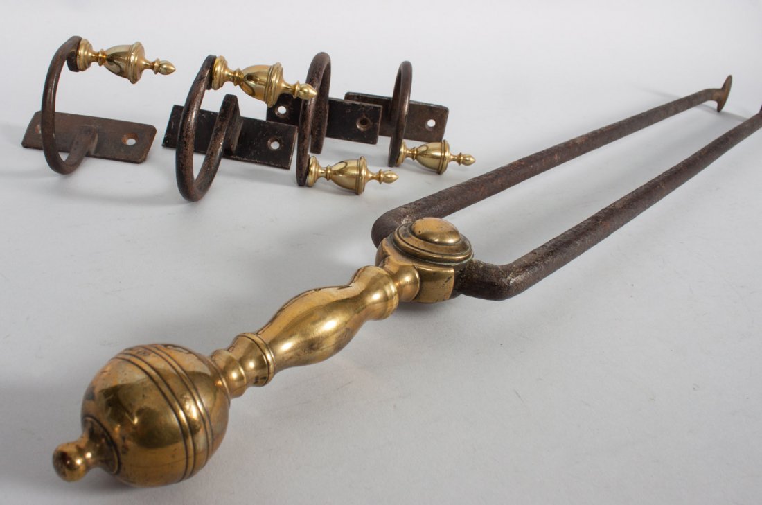 Federal brass and wrought iron fire tools: early 19th century; pair of tongs with brass ball top handle and wrought iron arms, with four wrought iron and brass jam hooks, each with brass finials