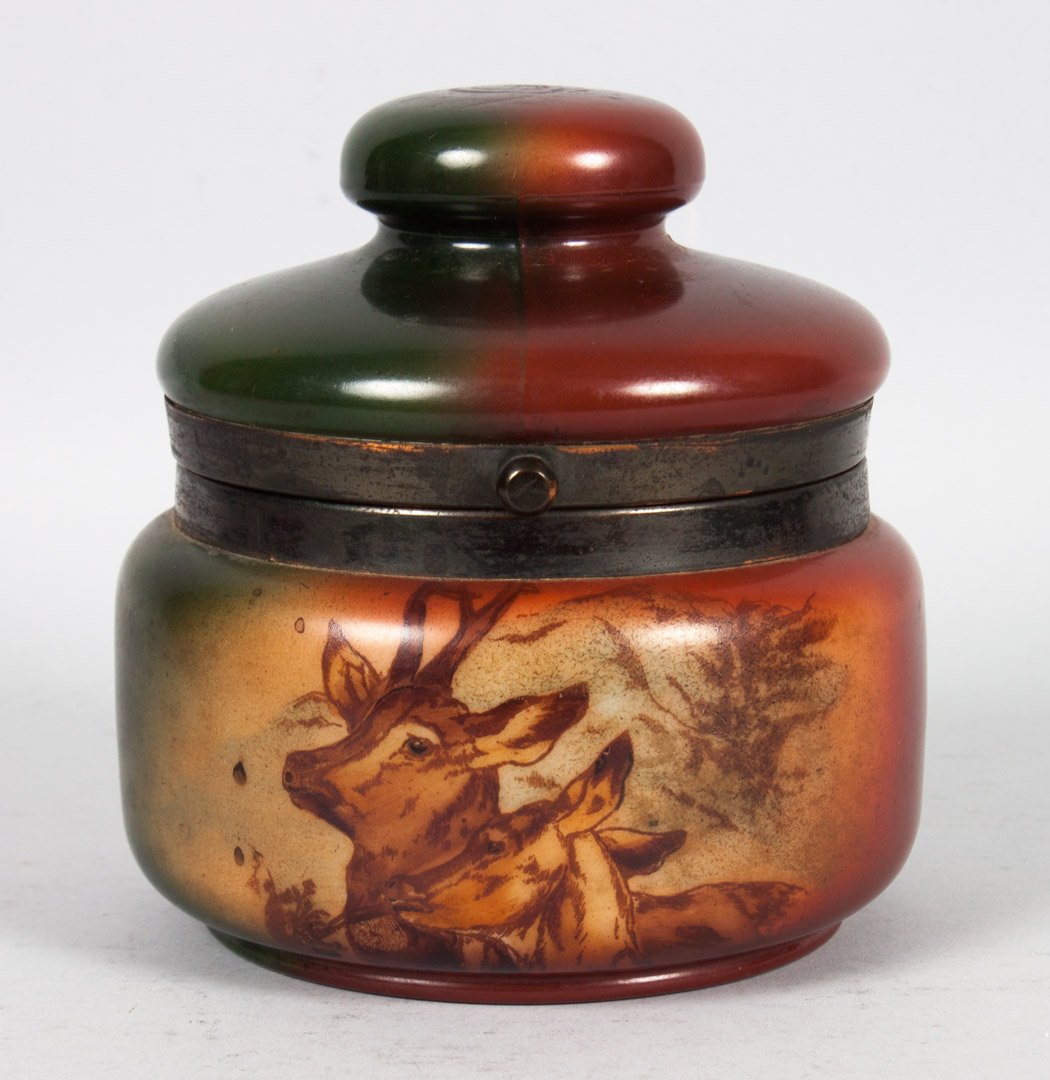 Handel milk glass tobacco jar: early 20th century; copper mounted painted milk glass jar with transfer deer and doe decoration, stamped "Handel Ware" 4091/F, 5 1/2 in. H., 5 in. Diam.
