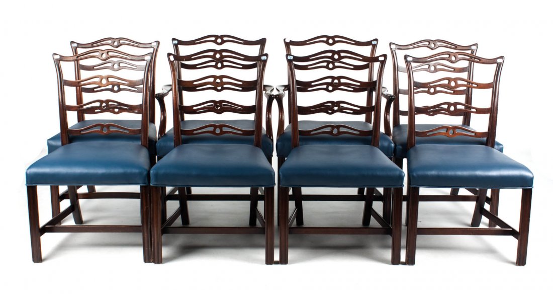 Eight Chippendale style dining chairs: comprising two arms and six sides, ladder- back dining chairs with faux leather upholstery over frame, 36 in. H., 25 in. W.