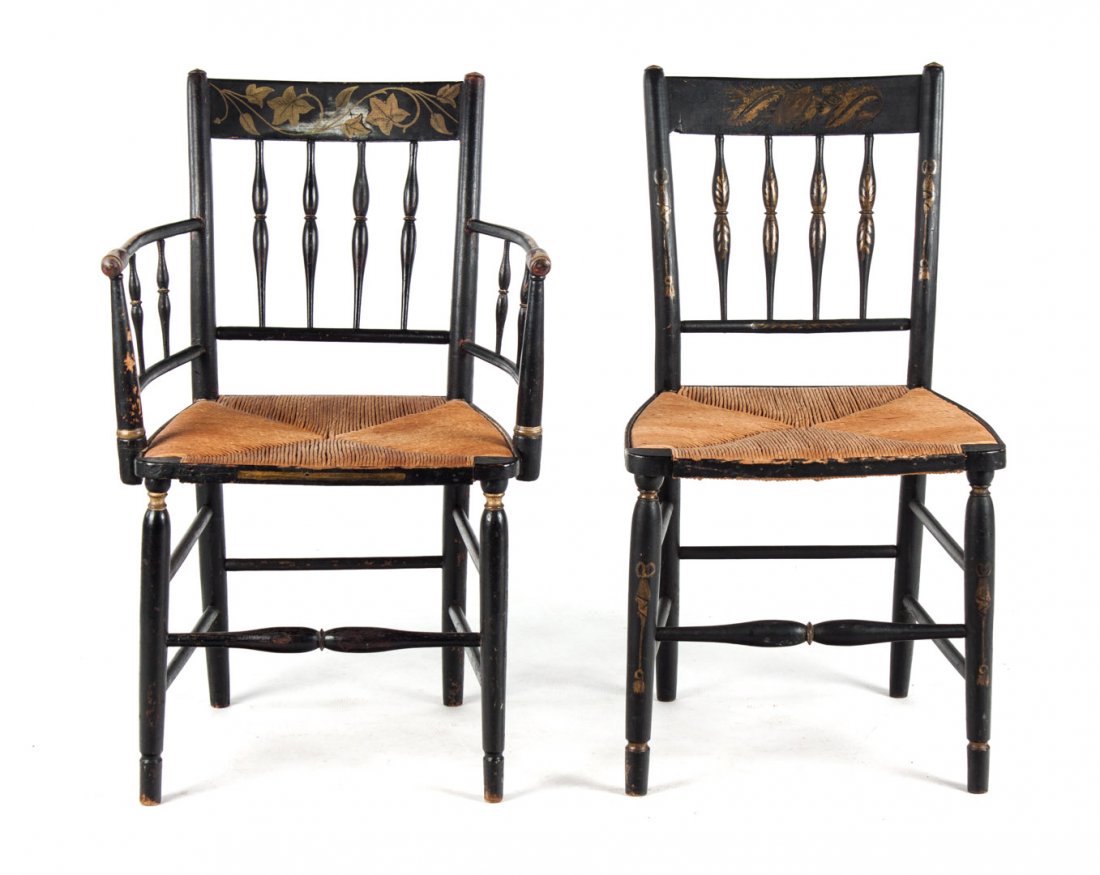 Two fancy painted wood rush-seat chairs: first quarter-19th century; armchair with ebonized wood and painted ivory decoration, side chair with ebonized and painted tassel and foliate decoration, both with rush seats, both are 34 in. H., appr