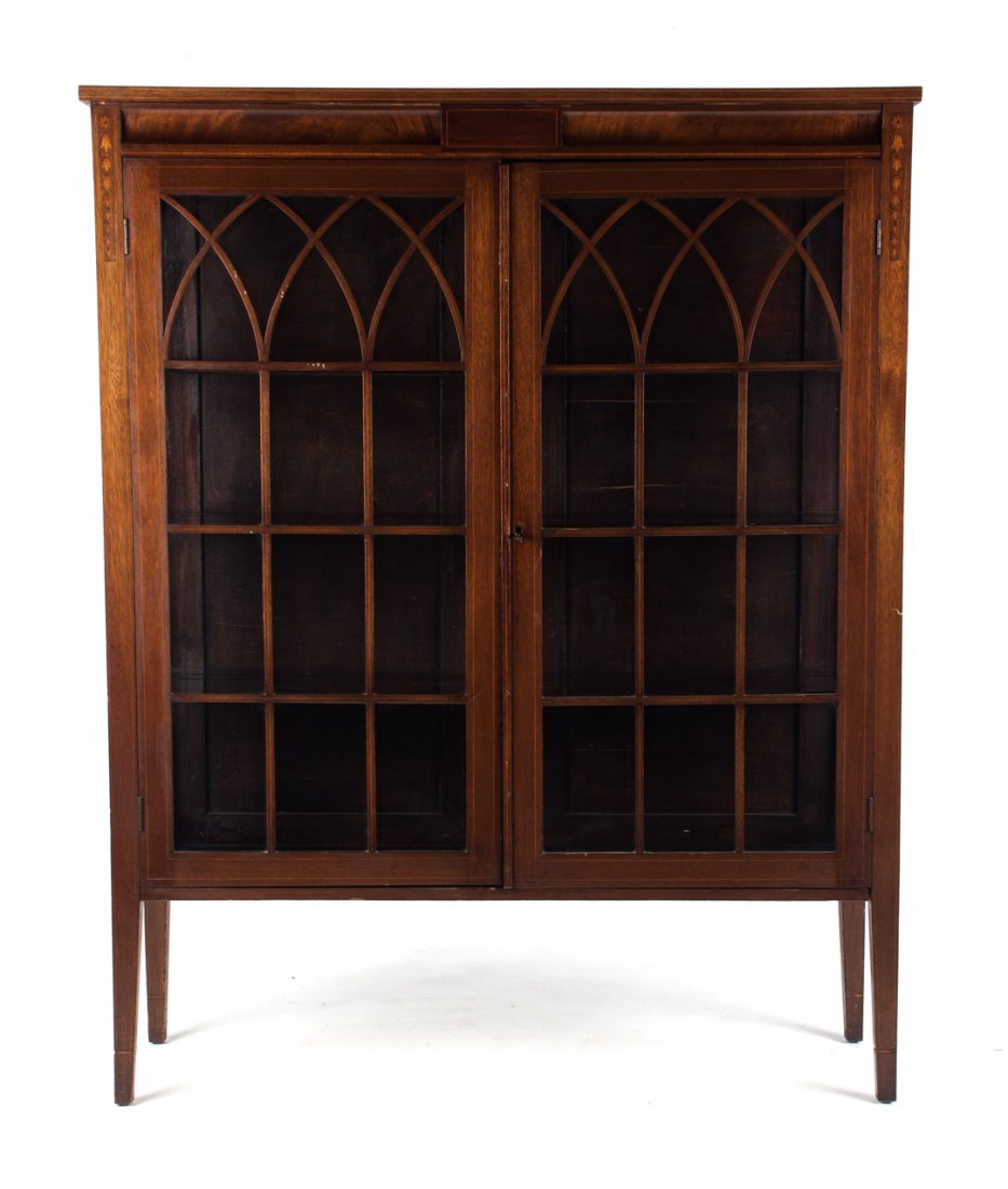 Edwardian mahogany china cabinet: early 20th century; mahogany with stringer inlay, two glazed panel doors and sides, 61 in. H., 49 in. W., 15 in. D.