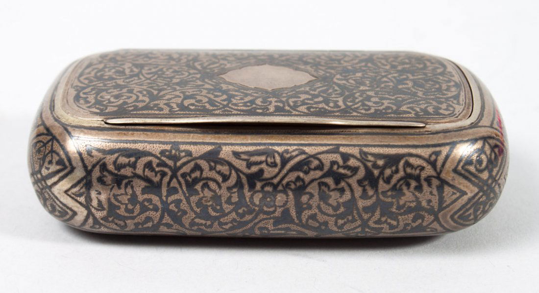 Russian niello enamel silver tobacco box: with Moscow assay marks dated 1877, unidentified maker (transliterated "N.F."); 1 in. H., 2 1/4 X 3 5/8 in.; 3.40 ozt., 84 standard