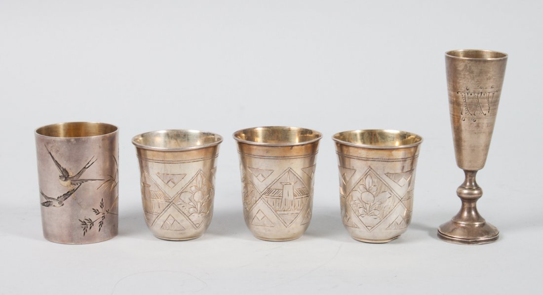 Russian engraved and gilt silver vodka cups: comprising: one with gilt-inlaid birds and foliage in the Aesthetic taste, kokoshnik assay mark of St. Petersburg, 1896-1903, unidentified maker (transliterated, "PA"); 1 7/8 in. H.; three with landsc