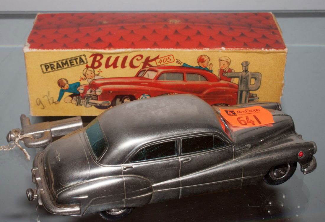 Prameta wind-up Buick: circa 1946; silver metal wind-up car with traffic cop-form wind-up key and fragmentary box, stamped "Made in Germany Brit. Zone"